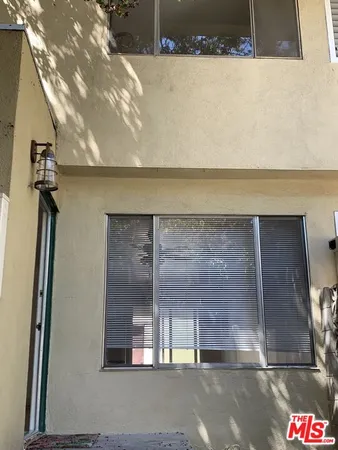 a view of path and flowers in yard