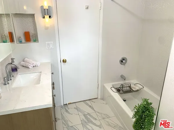 a kitchen with a sink and a stove