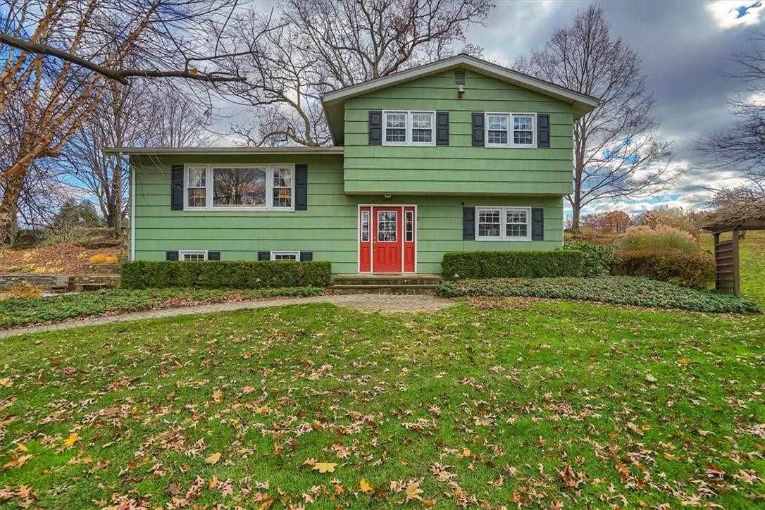 a front view of a house with a yard