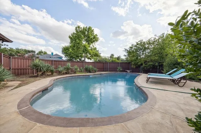 a living room with furniture and a grill