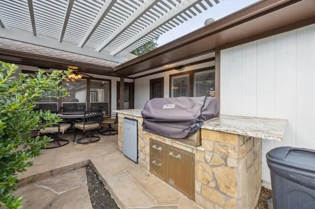 a table and chairs in a patio