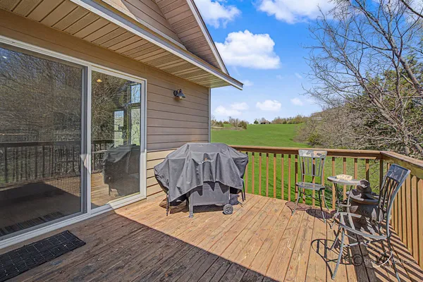 a view of a balcony with two chairs and a table
