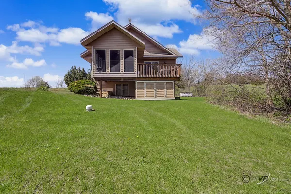 a view of a house with a big yard