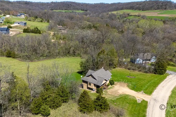 an aerial view of a house with a garden