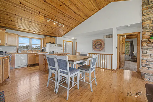 a dining room with wooden floors and wooden floors