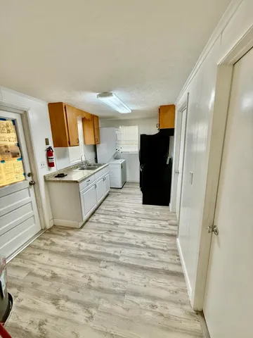 a large white bed in a white room