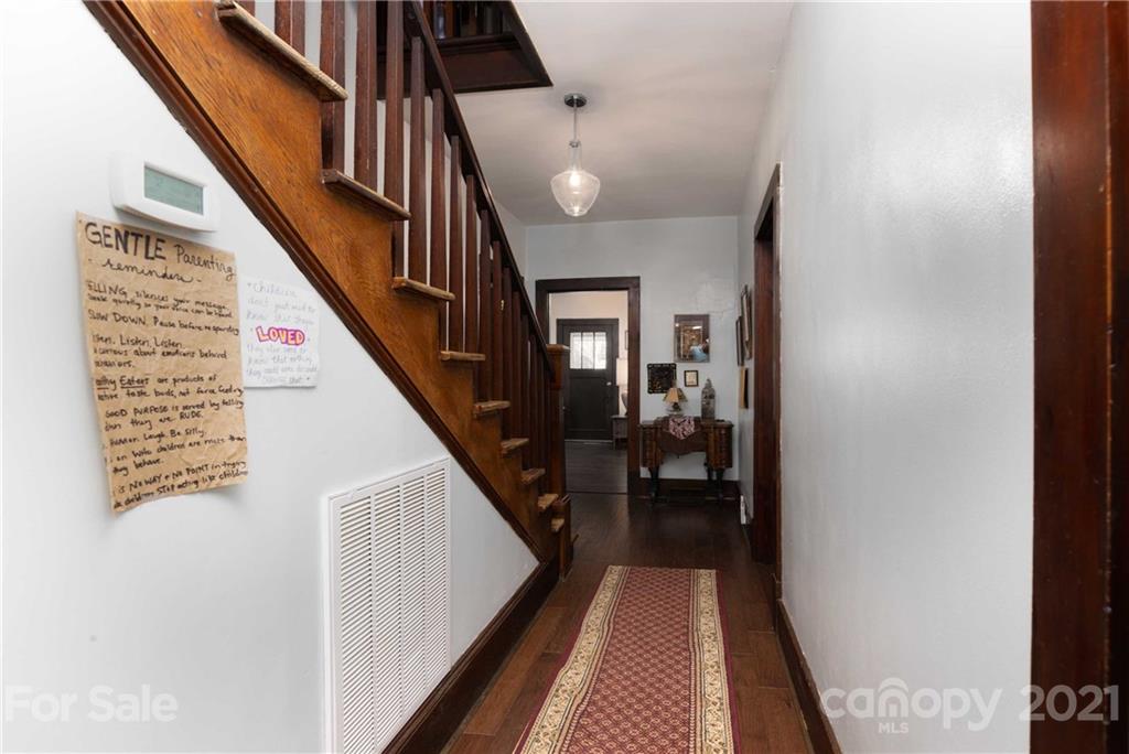 39 Baileys Peak Road Spruce Pine, NC 28777 - Photo 12 of 47 a view of a hallway with wooden floor and staircase