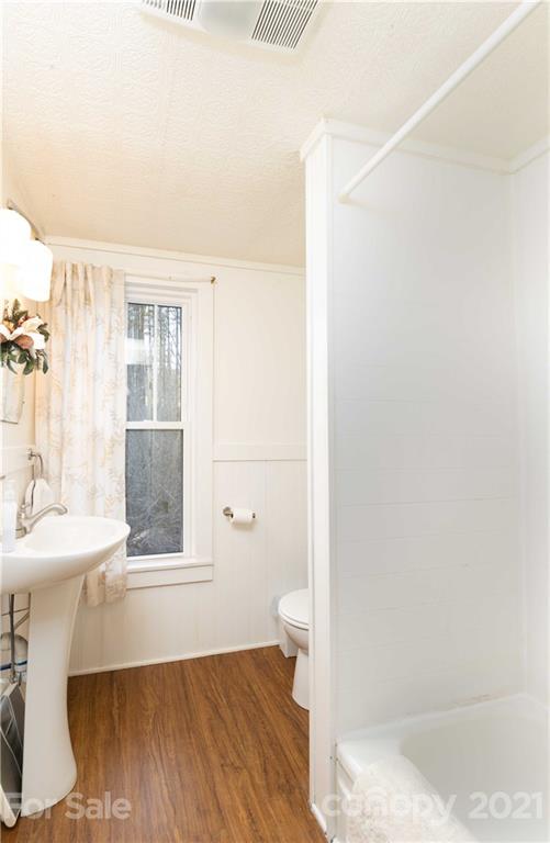 39 Baileys Peak Road Spruce Pine, NC 28777 - Photo 17 of 47 a bathroom with a sink and a toilet