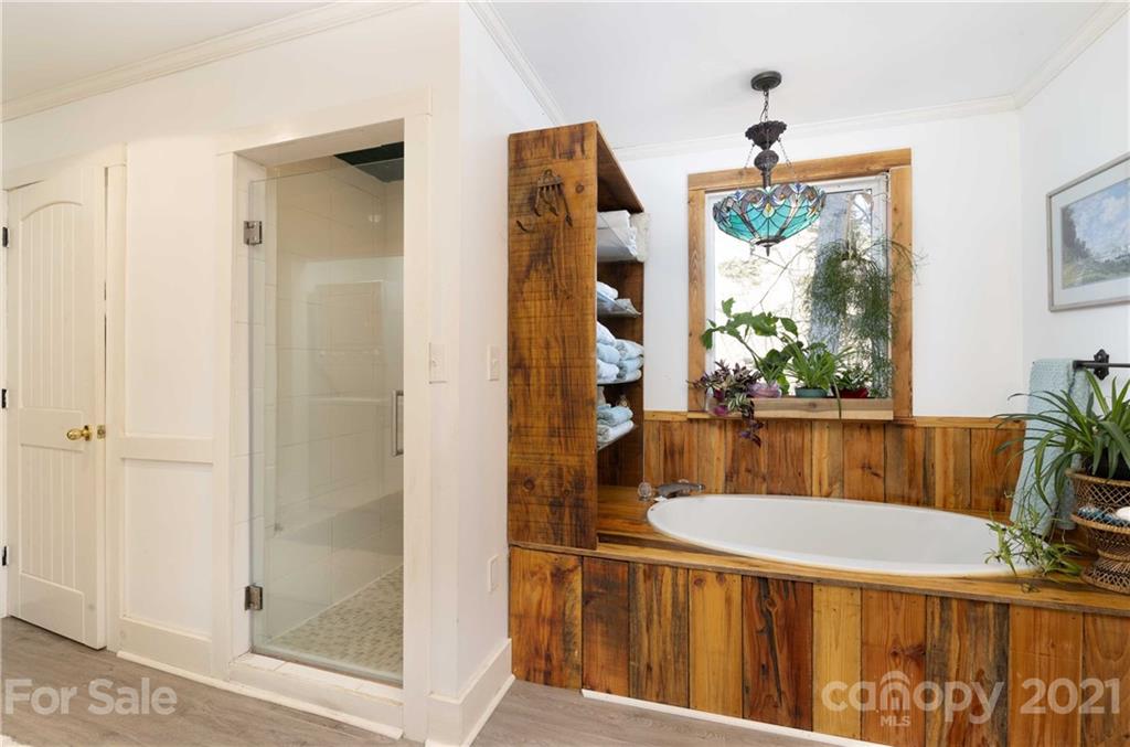 39 Baileys Peak Road Spruce Pine, NC 28777 - Photo 22 of 47 a bathroom with a sink and a mirror