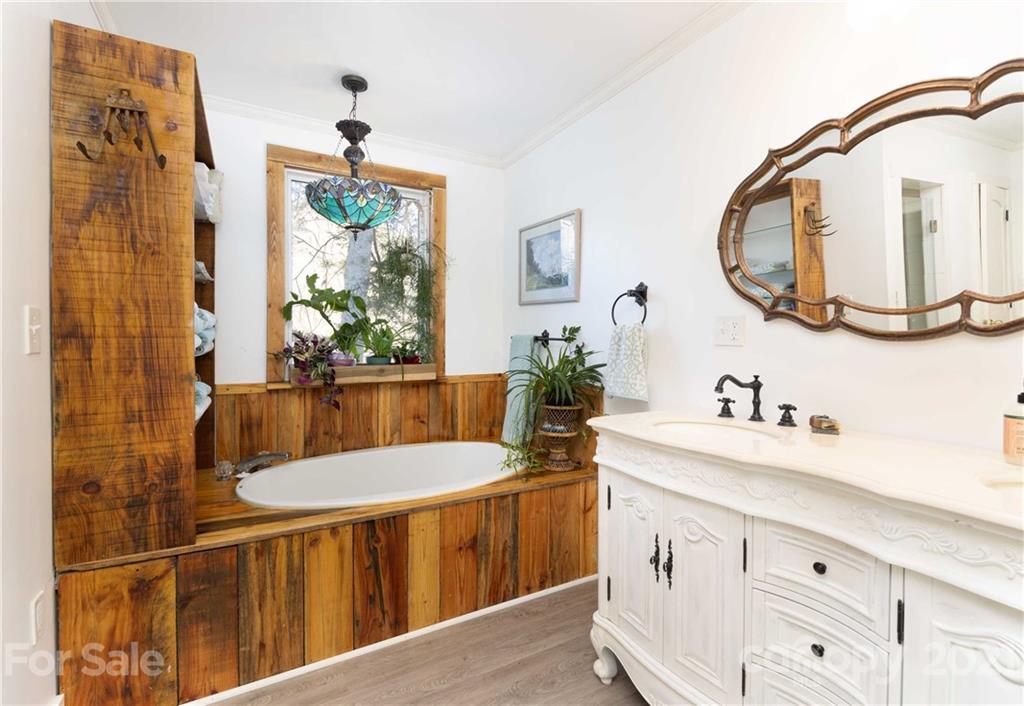 39 Baileys Peak Road Spruce Pine, NC 28777 - Photo 23 of 47 a bathroom with a sink and a mirror