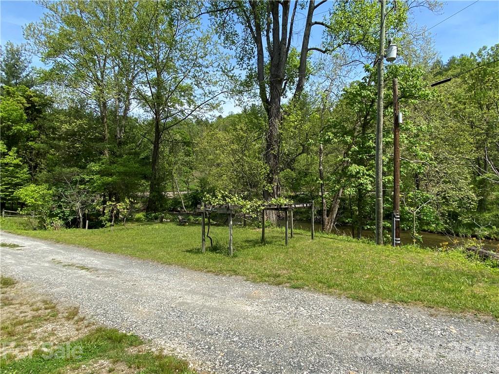 39 Baileys Peak Road Spruce Pine, NC 28777 - Photo 34 of 47 a view of grassy field with trees