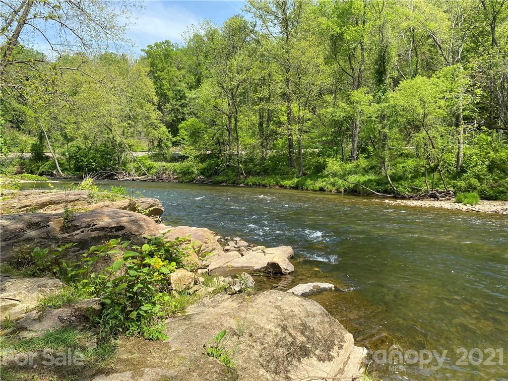 39 Baileys Peak Road Spruce Pine, NC 28777 - Photo 37 of 47 a backyard of a house with lots of green space