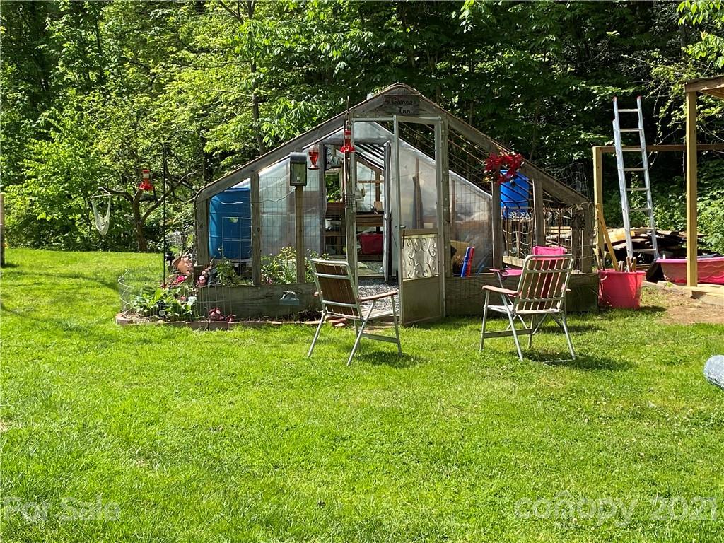 39 Baileys Peak Road Spruce Pine, NC 28777 - Photo 39 of 47 a view of an house with backyard and patio