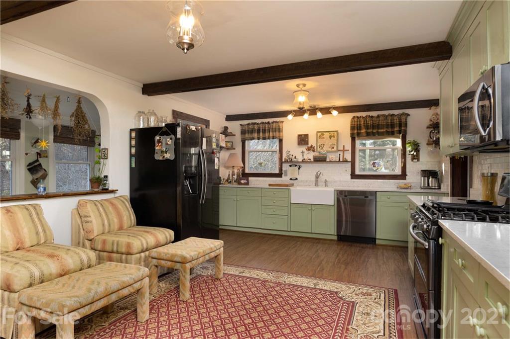 39 Baileys Peak Road Spruce Pine, NC 28777 - Photo 7 of 47 a living room with furniture and a kitchen