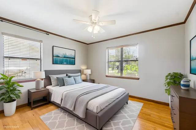 a bedroom with a bed and ceiling fan