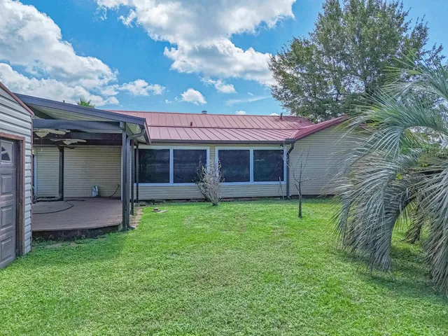 a view of a house with a garden