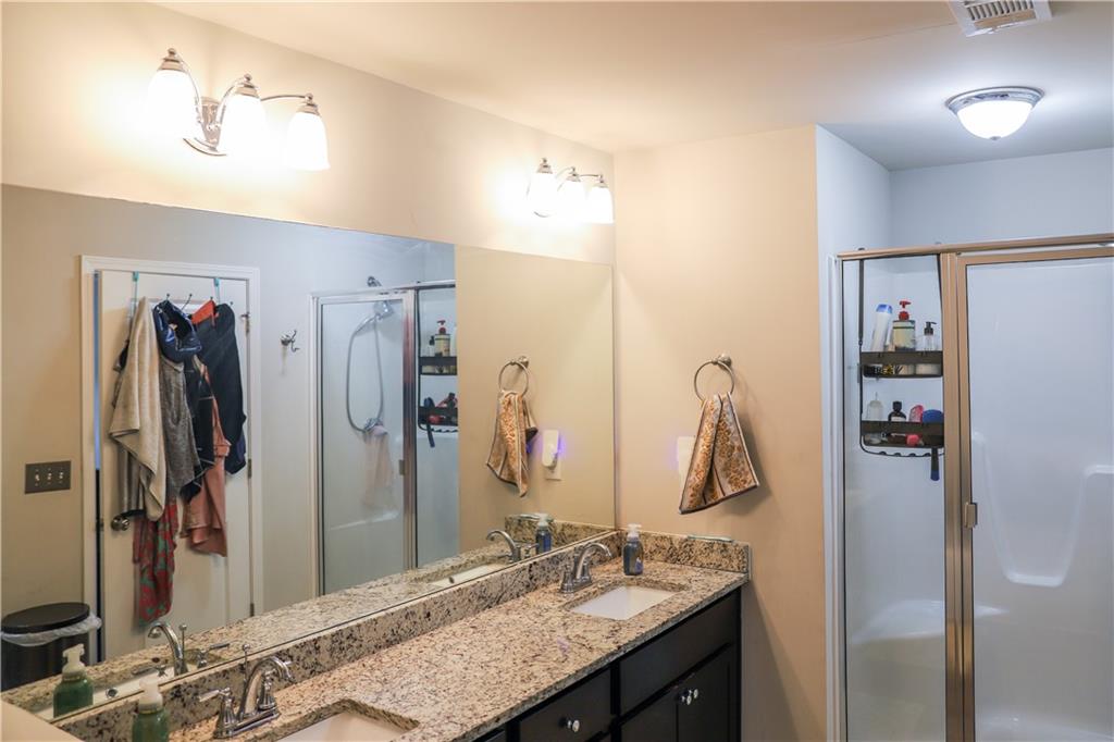 402 Mulberry Row Atlanta, GA 30354 - Photo 17 of 17 a bathroom with a granite countertop sink and a mirror