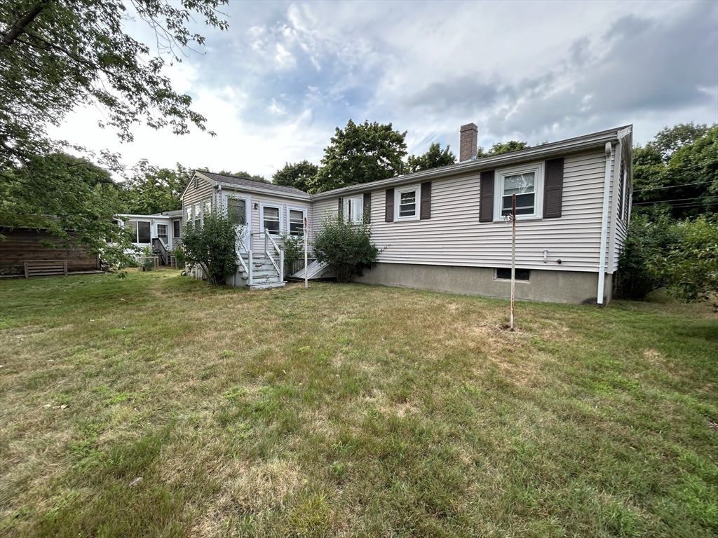 39 Longmeadow Road Beverly, MA 01915 - Photo 11 of 12 a view of a house with a yard