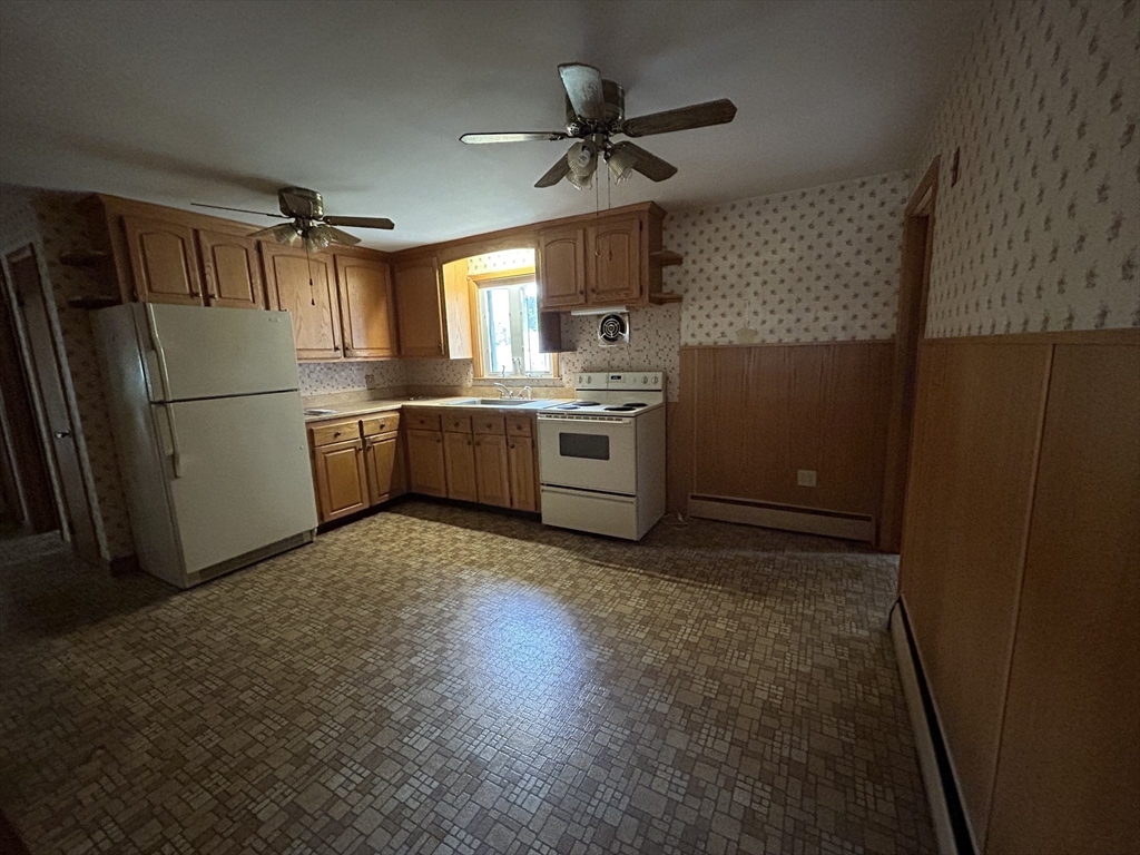 39 Longmeadow Road Beverly, MA 01915 - Photo 3 of 12 a kitchen with refrigerator and window