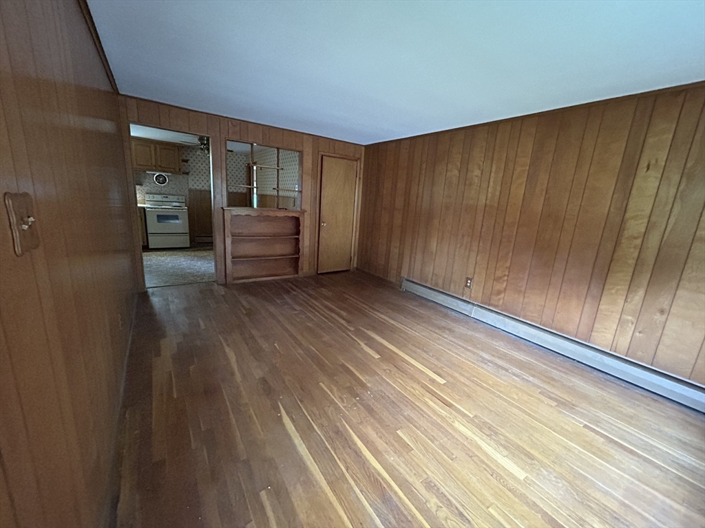 39 Longmeadow Road Beverly, MA 01915 - Photo 5 of 12 a view of a room with wooden floor and stairs