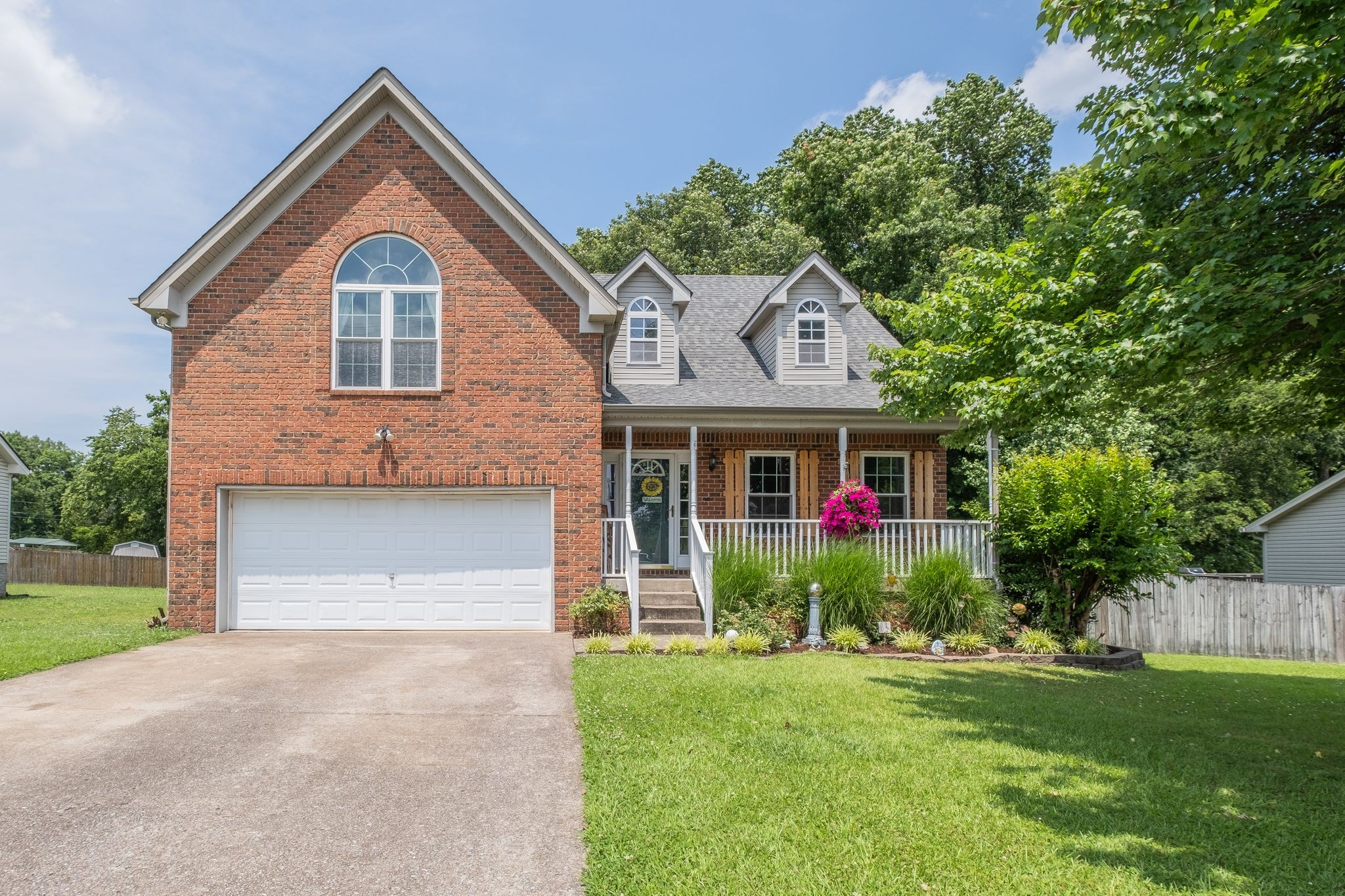 1040 Windtree Trace Mount Juliet, TN 37122 - Photo 1 of 30 a front view of a house with a yard and trees
