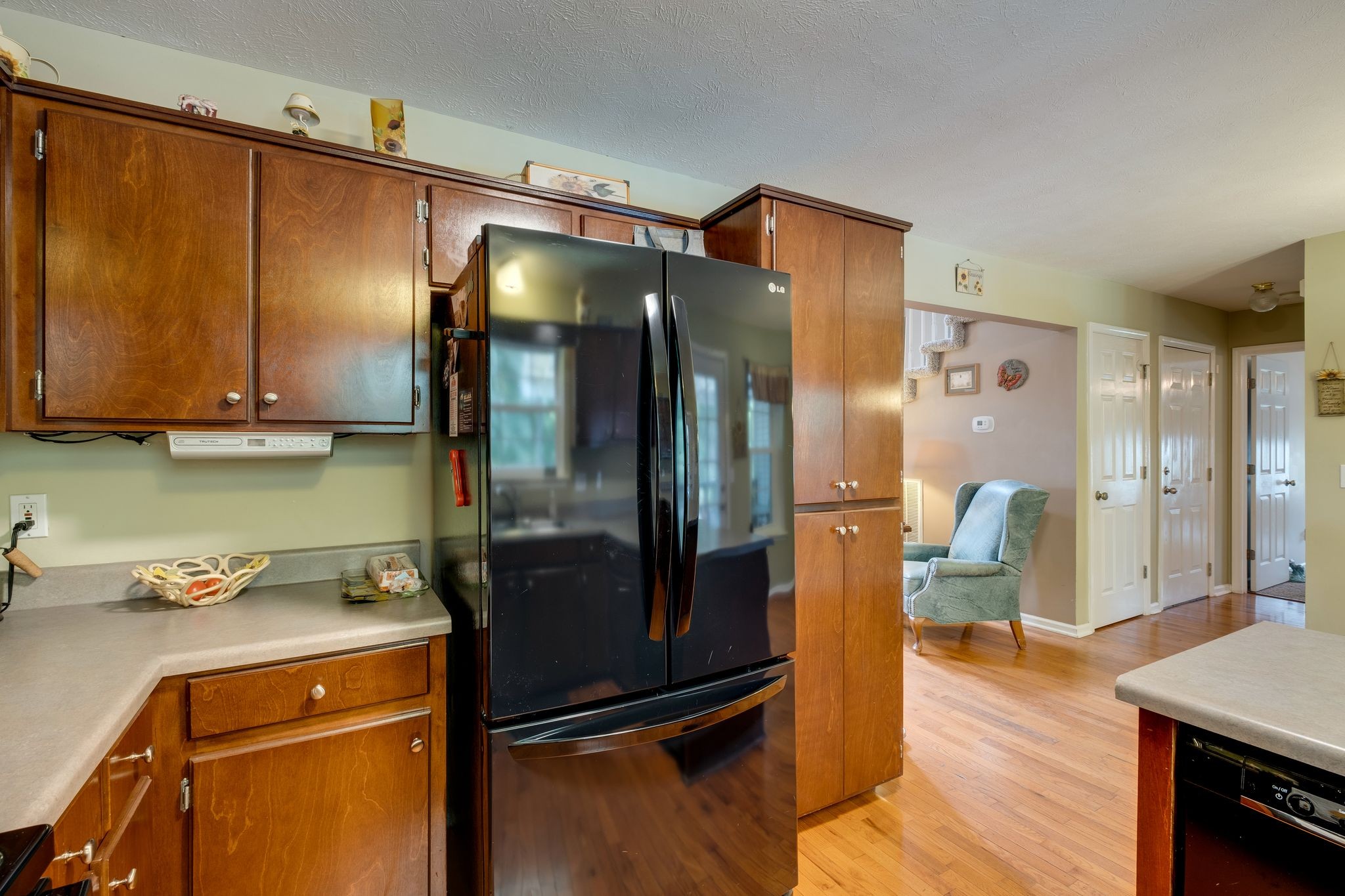 1040 Windtree Trace Mount Juliet, TN 37122 - Photo 14 of 30 a kitchen with a refrigerator and cabinets