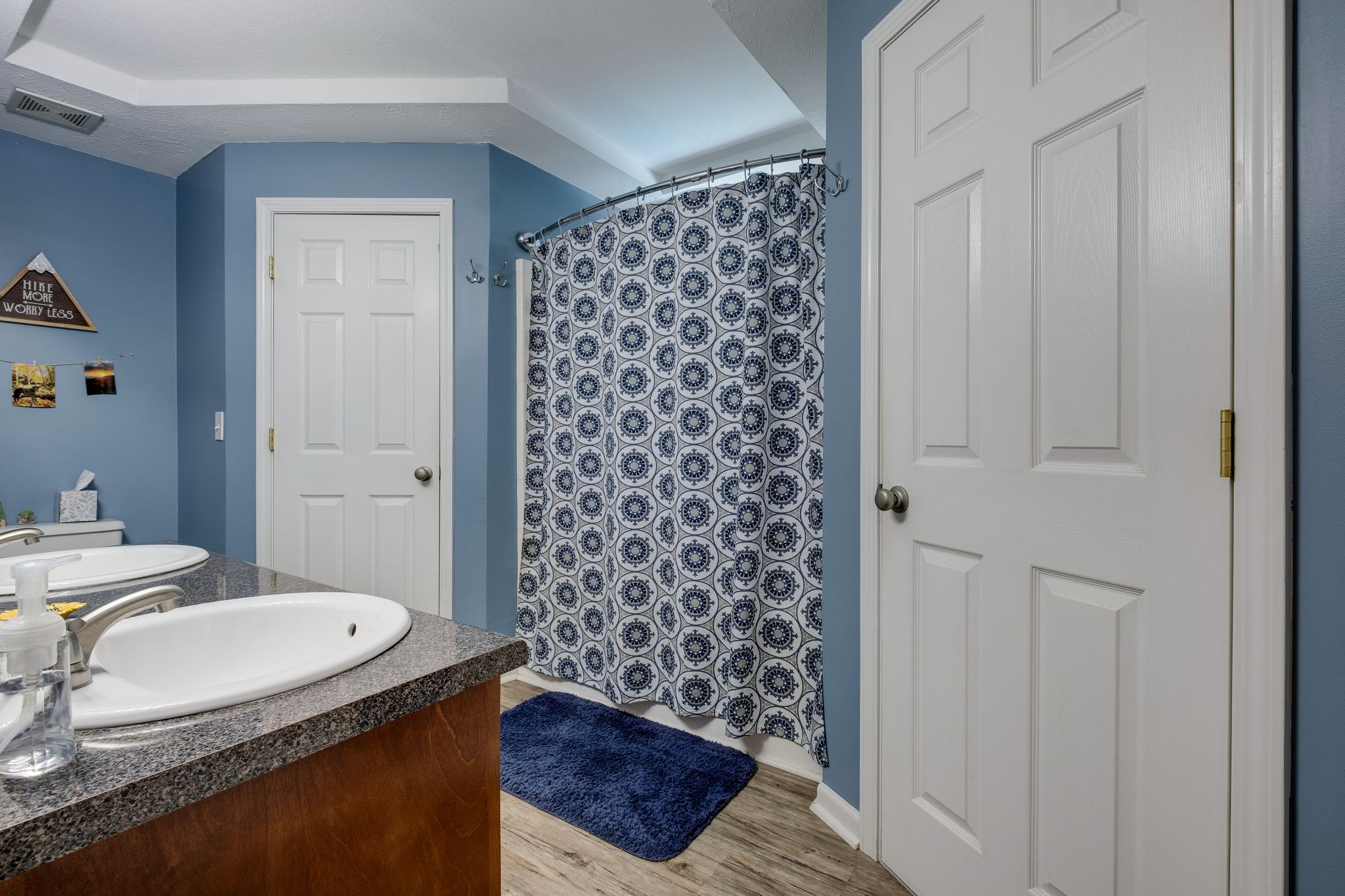 1040 Windtree Trace Mount Juliet, TN 37122 - Photo 17 of 30 a bathroom with a granite countertop sink a toilet and shower