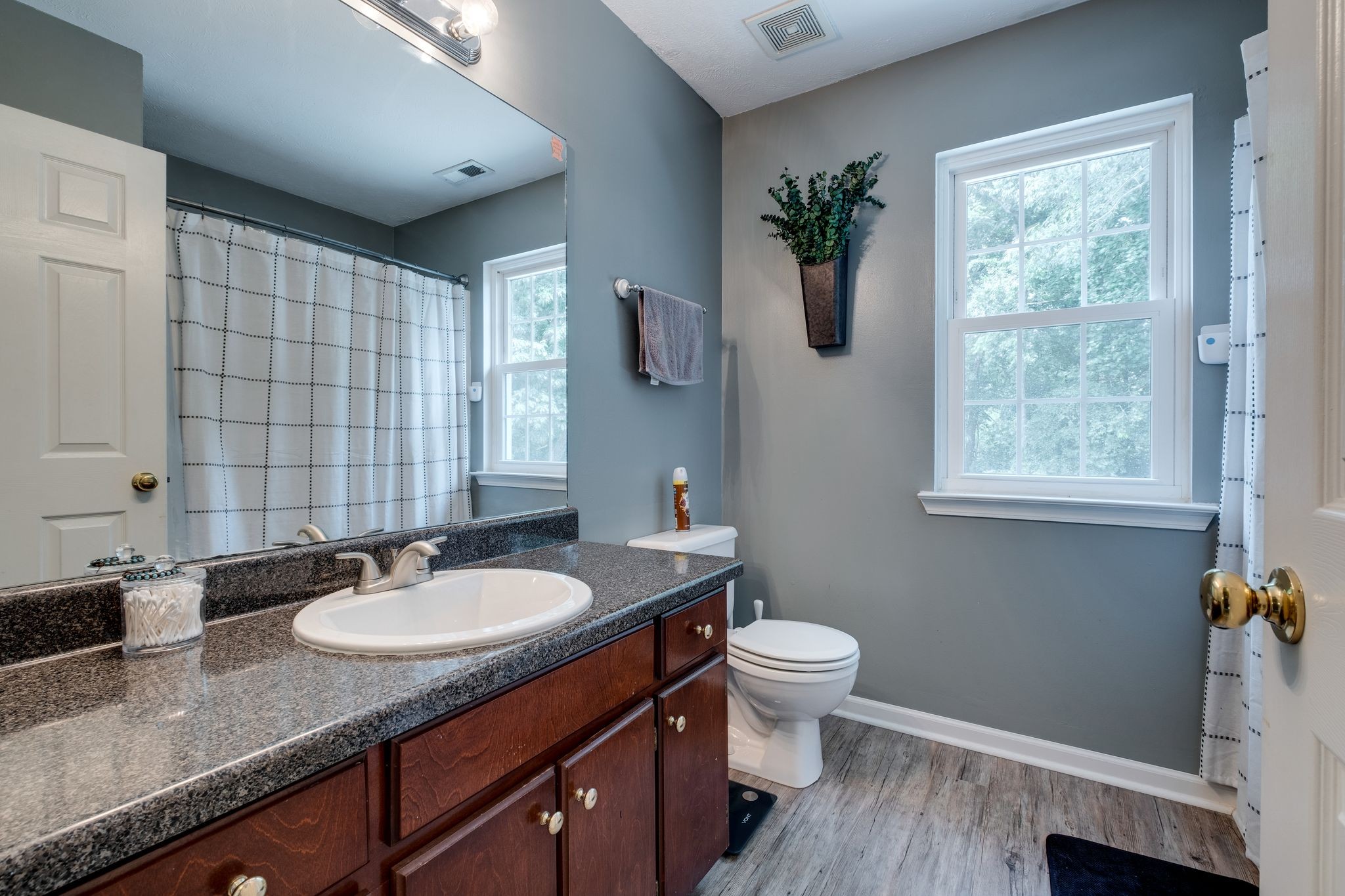 1040 Windtree Trace Mount Juliet, TN 37122 - Photo 22 of 30 a bathroom with a granite countertop sink toilet and a mirror