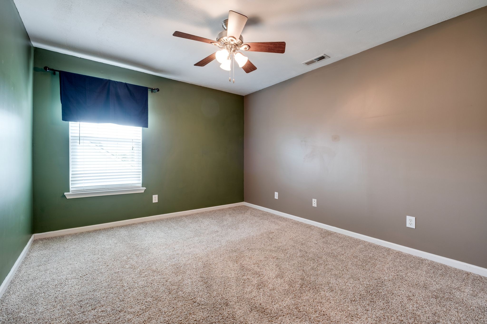 1040 Windtree Trace Mount Juliet, TN 37122 - Photo 23 of 30 a view of a room with a ceiling fan and a window