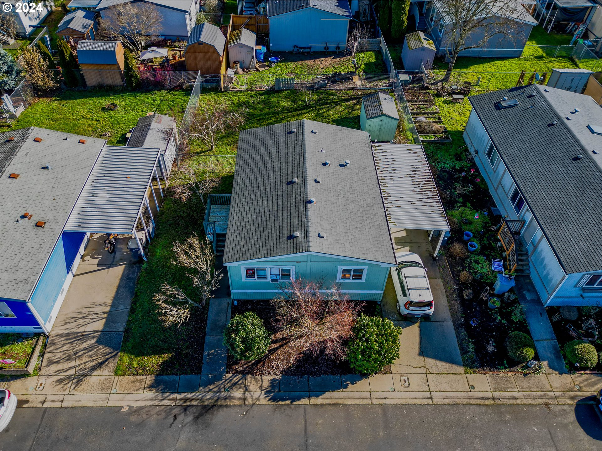 2151 Three Lakes Road Southeast, Unit 17 Albany, OR 97322 - Photo 27 of 34 an aerial view of multiple houses with a yard