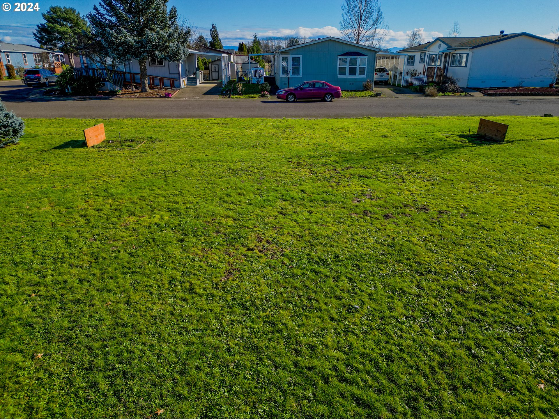 2151 Three Lakes Road Southeast, Unit 17 Albany, OR 97322 - Photo 31 of 34 a view of a house with a big yard and large trees