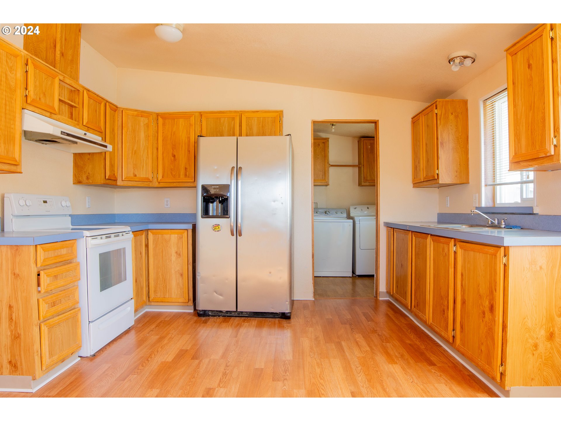 2151 Three Lakes Road Southeast, Unit 17 Albany, OR 97322 - Photo 9 of 34 a view of a kitchen with stainless steel appliances granite countertop a refrigerator and a sink