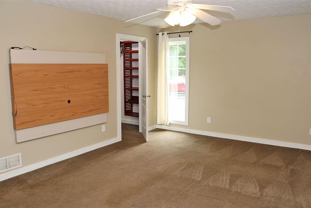 3129 Etchison Road Loganville, GA 30052 - Photo 16 of 58 an empty room with a door