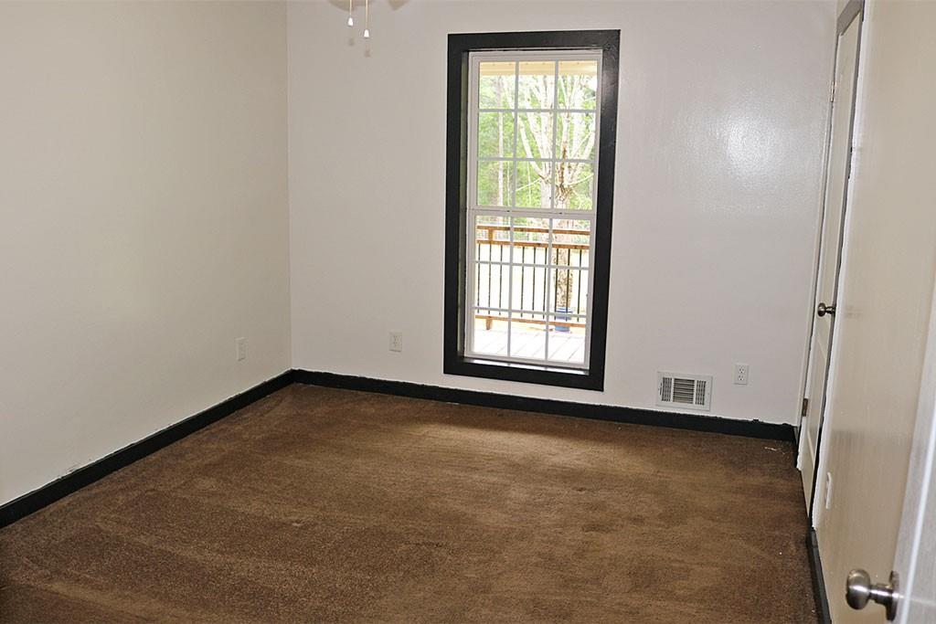3129 Etchison Road Loganville, GA 30052 - Photo 19 of 58 an empty room with windows