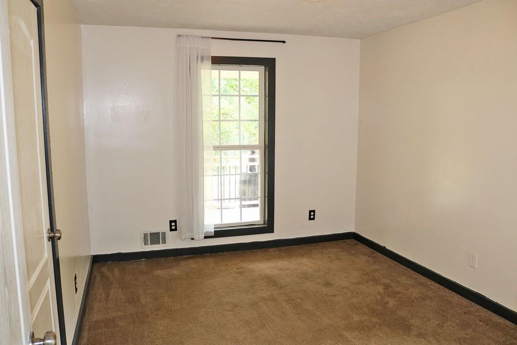 3129 Etchison Road Loganville, GA 30052 - Photo 20 of 58 an empty room with a window