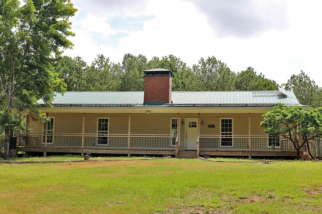 3129 Etchison Road Loganville, GA 30052 - Photo 2 of 58 a front view of a house with a yard