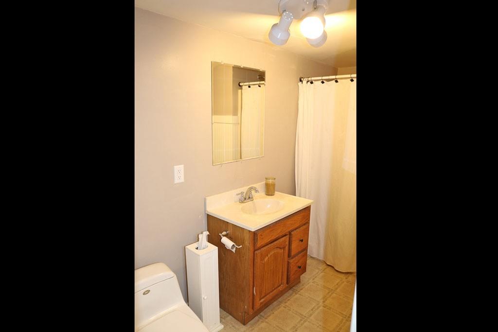 3129 Etchison Road Loganville, GA 30052 - Photo 23 of 58 a bathroom with a sink and a mirror