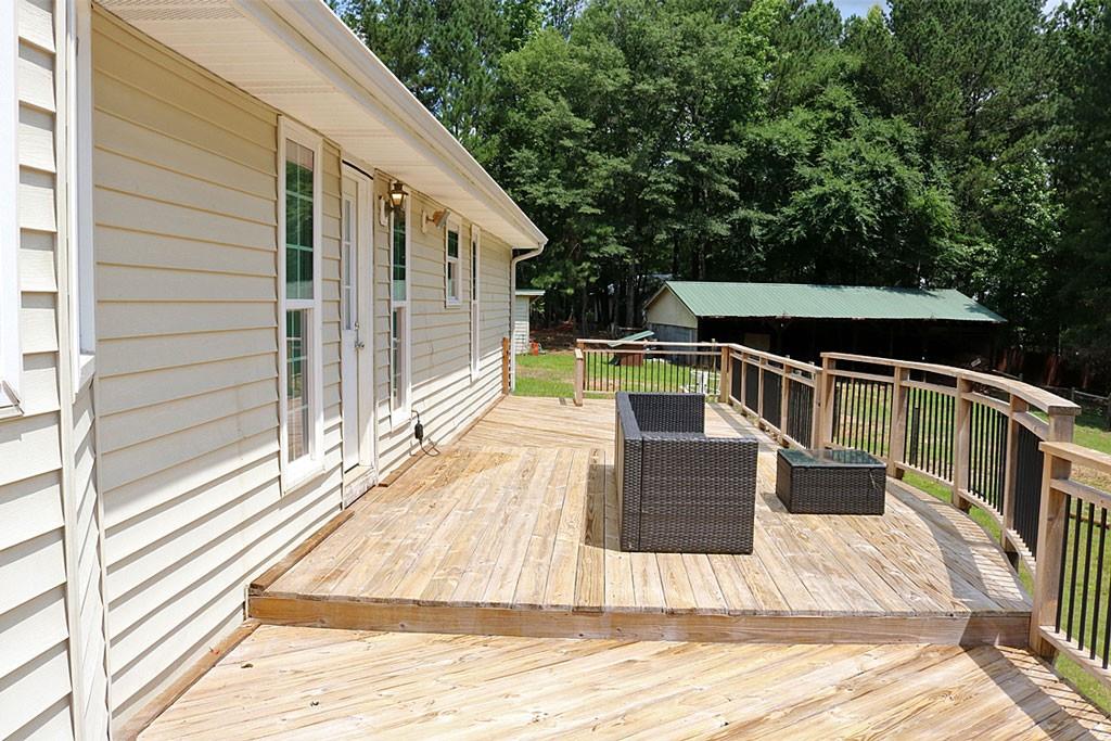 3129 Etchison Road Loganville, GA 30052 - Photo 28 of 58 a view of balcony with wooden floor and seating space