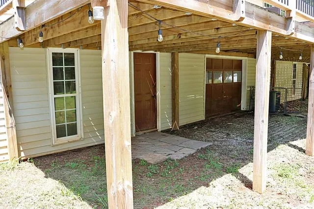 a view of a swimming pool with a chair and tables