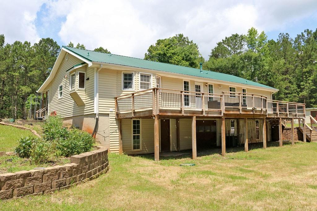 3129 Etchison Road Loganville, GA 30052 - Photo 32 of 58 a view of a house with a backyard