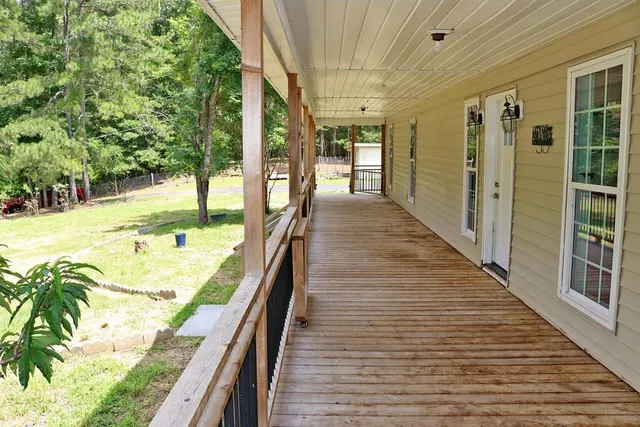 a view of swimming pool with seating space