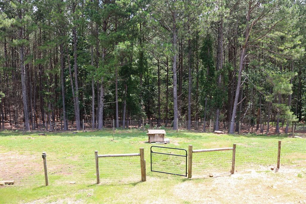 3129 Etchison Road Loganville, GA 30052 - Photo 46 of 58 a view of a swimming pool with a bench
