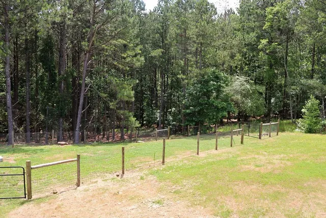 a backyard of a house with lots of green space