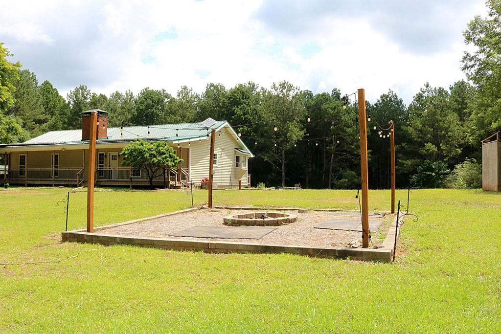 3129 Etchison Road Loganville, GA 30052 - Photo 50 of 58 a view of a swimming pool with a yard