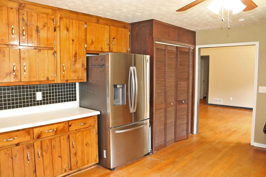 3129 Etchison Road Loganville, GA 30052 - Photo 6 of 58 a kitchen with stainless steel appliances granite countertop a refrigerator and a stove