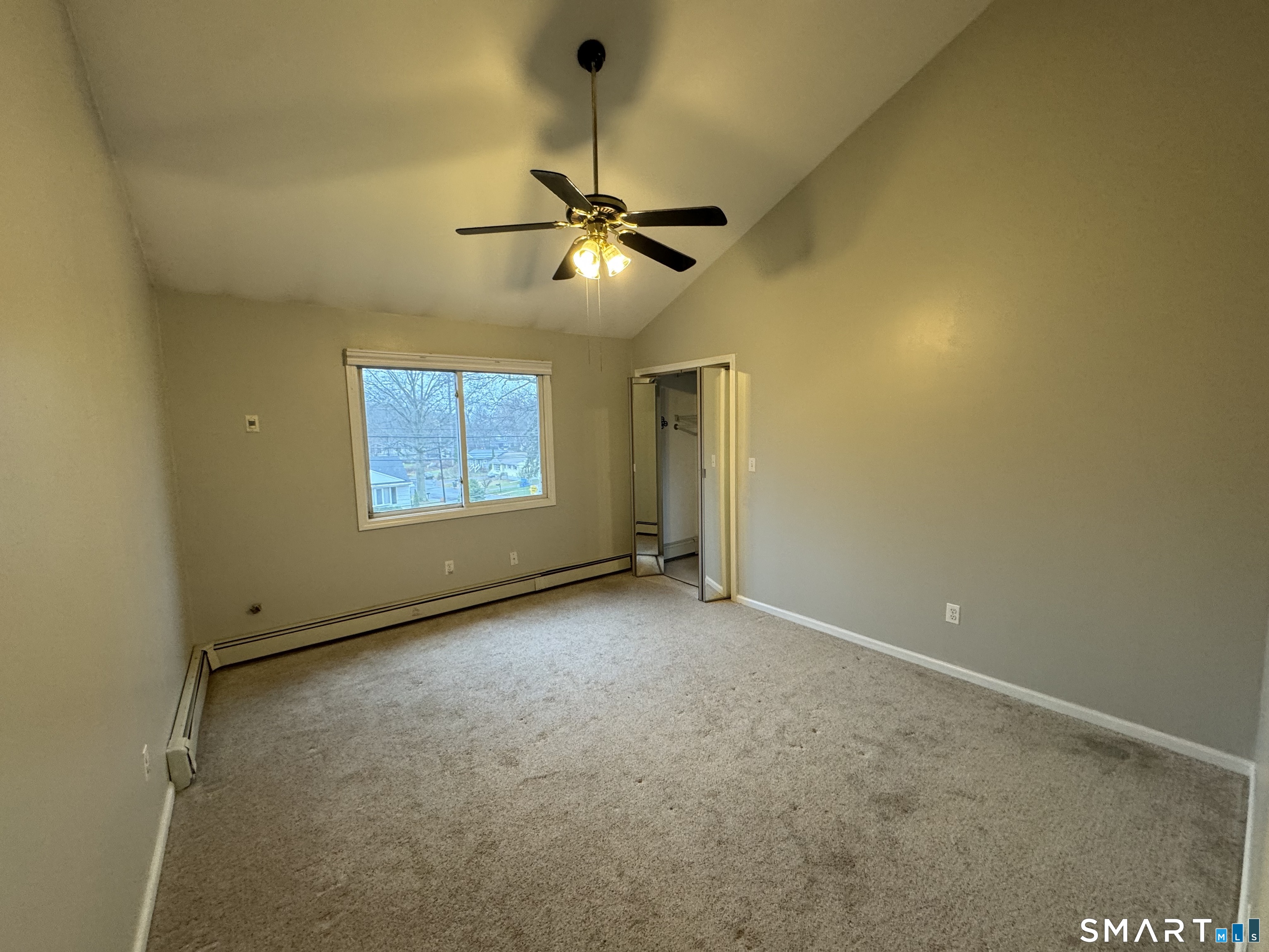 1880 Old Town Road Trumbull, CT 06611 - Photo 11 of 18 an empty room with windows and fan