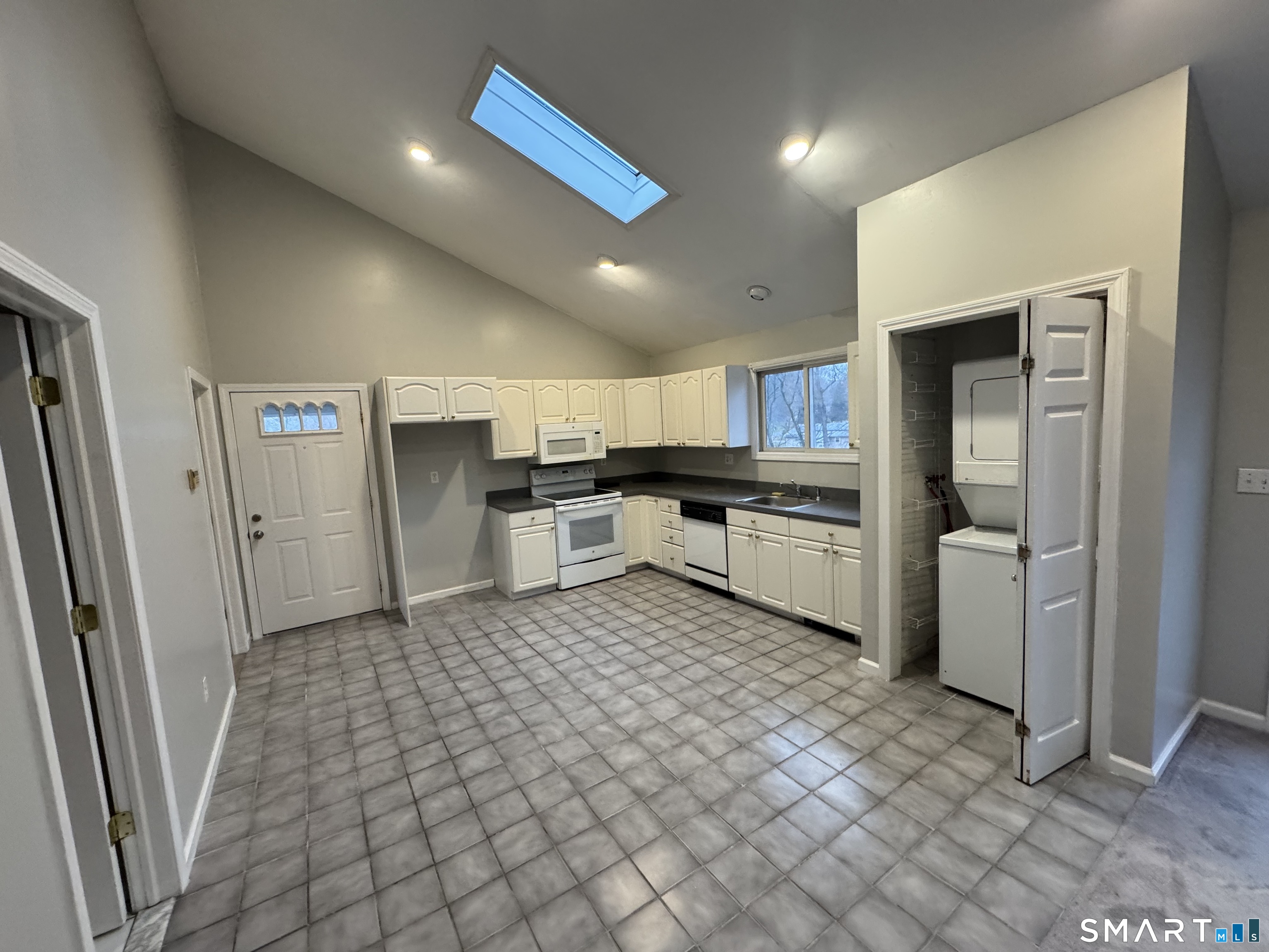 1880 Old Town Road Trumbull, CT 06611 - Photo 6 of 18 a kitchen with stainless steel appliances granite countertop a refrigerator and a sink