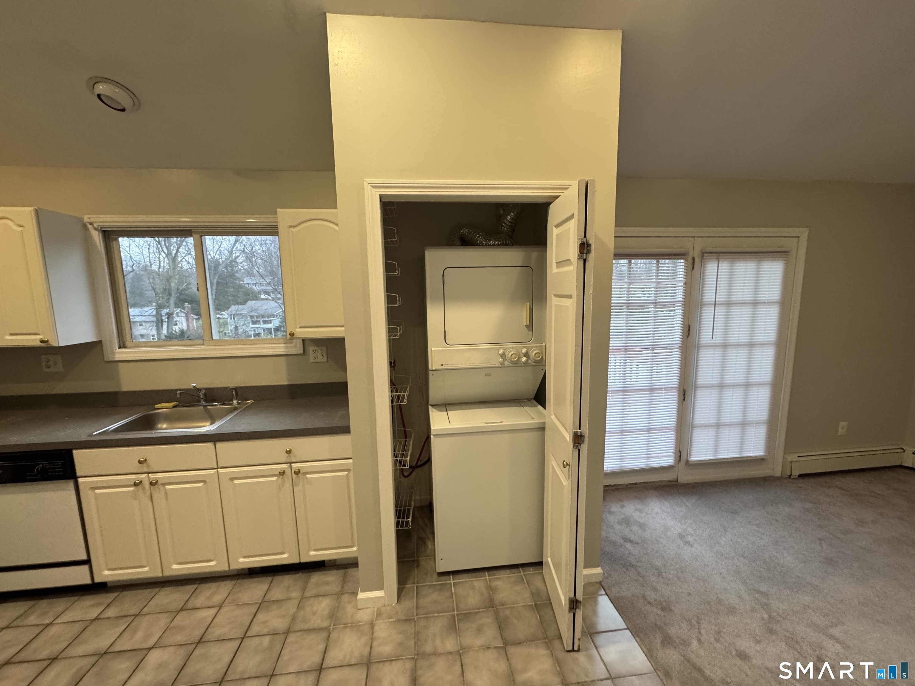 1880 Old Town Road Trumbull, CT 06611 - Photo 8 of 18 a kitchen with a sink cabinets and a window