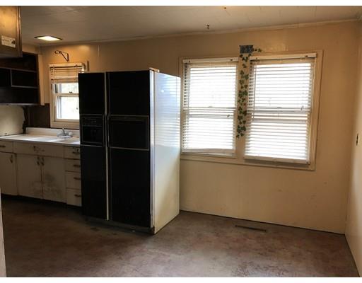 419 Plain Road Greenfield, MA 01301 - Photo 4 of 19 a kitchen with a window and a refrigerator