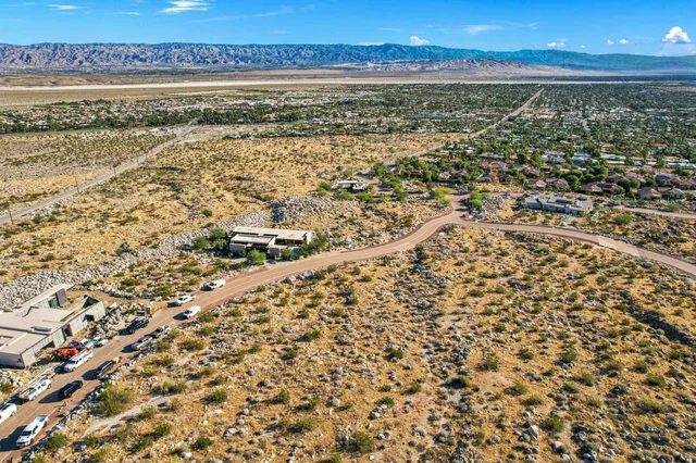 a view of a yard with wooden fence